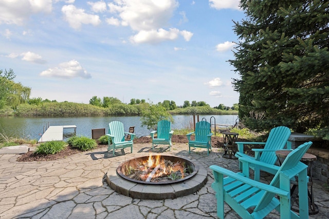 12187 Dunkirk St NE, Blaine, MN 55449 - view of patio / terrace with an outdoor fire pit, a water view, and a boat dock