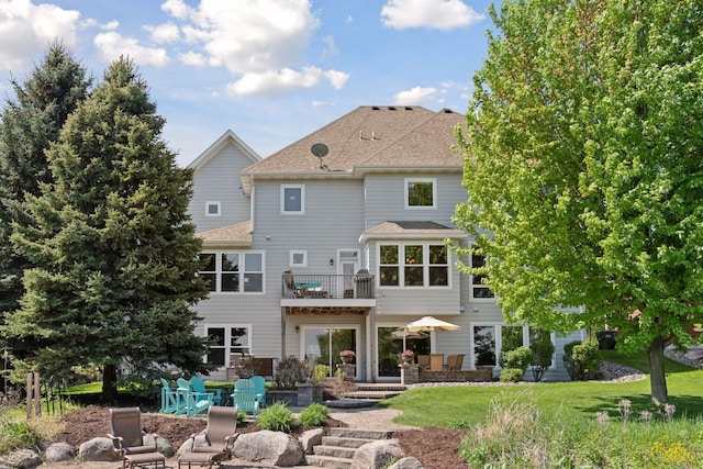 12187 Dunkirk St NE, Blaine, MN 55449 - back of property with a patio area, a balcony, and a yard