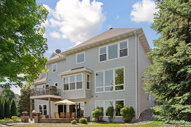 12187 Dunkirk St NE, Blaine, MN 55449 - rear view of house with a balcony and a patio area