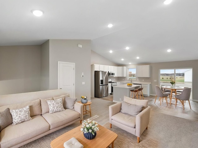 6718 Granby St, North Branch, MN 55056 - living area with light wood-style flooring, vaulted ceiling, and recessed lighting