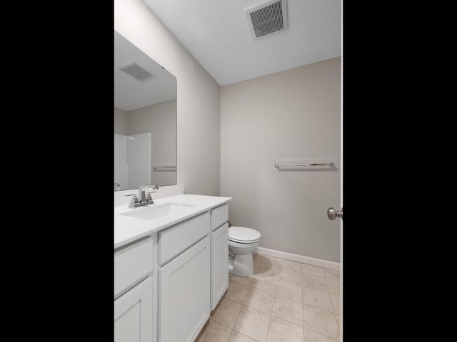 6718 Granby St, North Branch, MN 55056 - bathroom featuring toilet, baseboards, vanity, and tile patterned floors