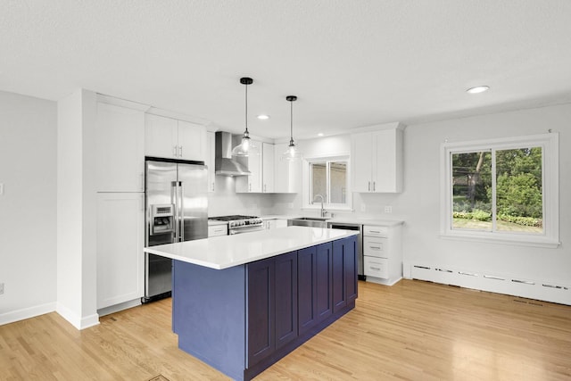 1409 Smith Ave S, West Saint Paul, MN 55118 - kitchen with high quality appliances, white cabinets, light wood finished floors, light countertops, and recessed lighting