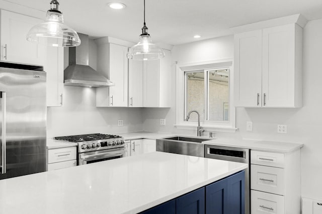 1409 Smith Ave S, West Saint Paul, MN 55118 - kitchen with wall chimney range hood, blue cabinetry, stainless steel appliances, light countertops, and white cabinets