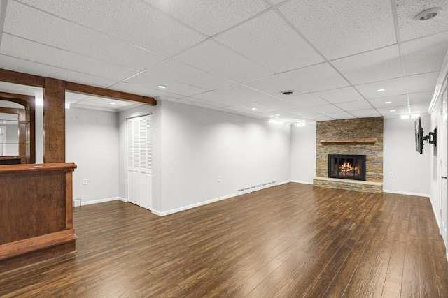 1409 Smith Ave S, West Saint Paul, MN 55118 - unfurnished living room featuring hardwood / wood-style flooring, a fireplace, baseboard heating, and a paneled ceiling