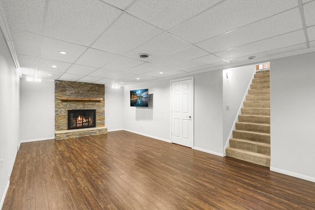 1409 Smith Ave S, West Saint Paul, MN 55118 - unfurnished living room featuring a paneled ceiling, wood finished floors, stairs, recessed lighting, and a fireplace