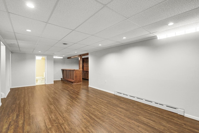 1409 Smith Ave S, West Saint Paul, MN 55118 - finished below grade area featuring a baseboard heating unit, wood finished floors, recessed lighting, bar, and a paneled ceiling