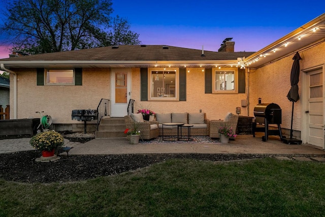 1409 Smith Ave S, West Saint Paul, MN 55118 - back of property with an outdoor hangout area, stucco siding, a chimney, a yard, and a patio area