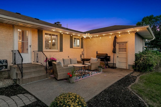 1409 Smith Ave S, West Saint Paul, MN 55118 - back of house at dusk with a patio area, outdoor lounge area, stucco siding, and a chimney