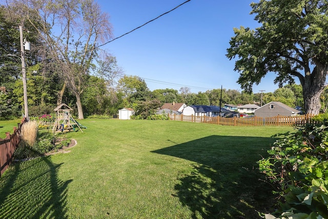 1409 Smith Ave S, West Saint Paul, MN 55118 - fenced backyard with a playground and a shed