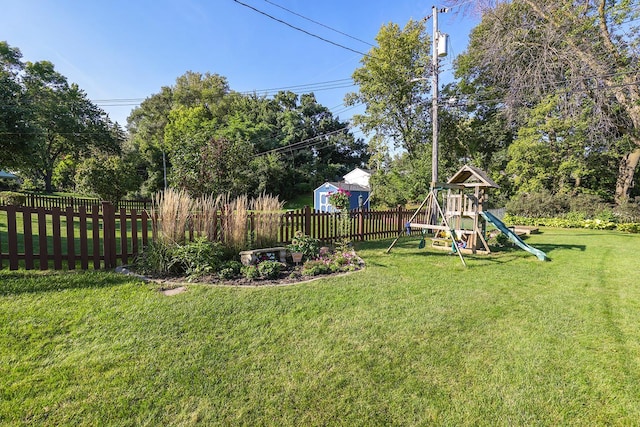 1409 Smith Ave S, West Saint Paul, MN 55118 - view of yard with a playground and view of wooded area