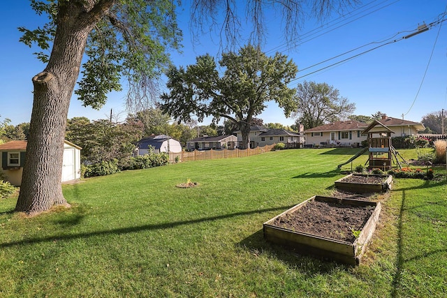 1409 Smith Ave S, West Saint Paul, MN 55118 - view of yard featuring a garden, a storage shed, and a residential view