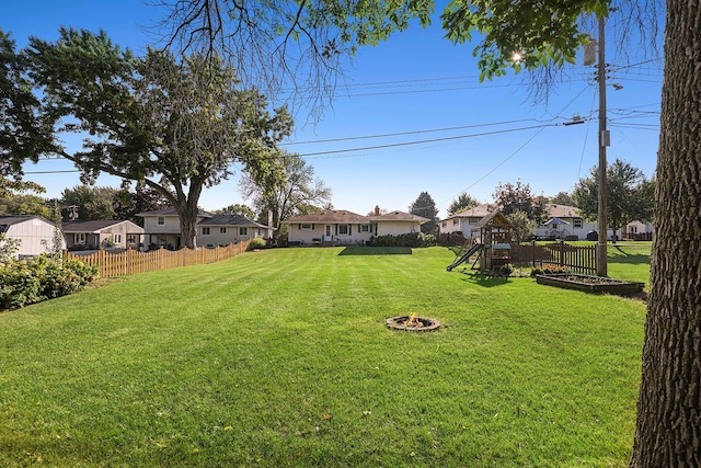 1409 Smith Ave S, West Saint Paul, MN 55118 - view of yard with a residential view, a playground, and an outdoor fire pit