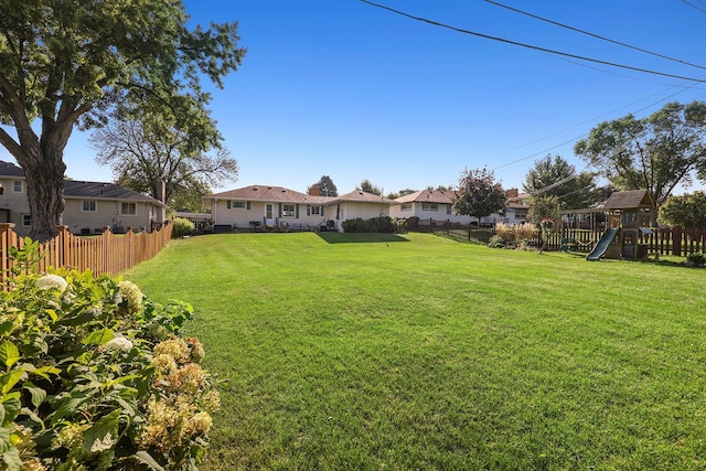1409 Smith Ave S, West Saint Paul, MN 55118 - fenced backyard featuring a residential view and a playground