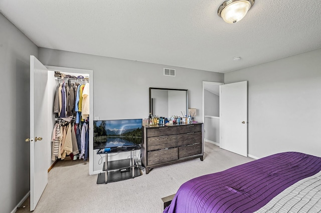 1527 Dublin Ct, Shakopee, MN 55379 - carpeted bedroom with a spacious closet, baseboards, and a textured ceiling