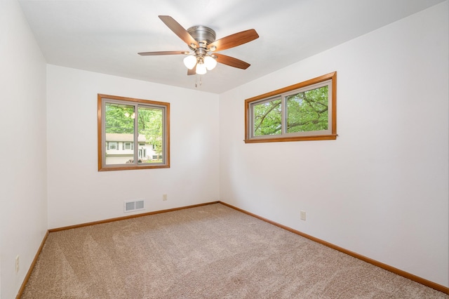 328 County Road B2 W, Roseville, MN 55113 - carpeted spare room with healthy amount of natural light, baseboards, and ceiling fan