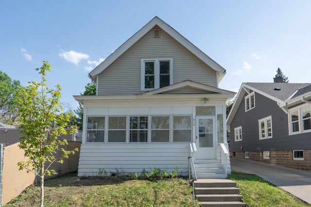 410 Baker St W, Saint Paul, MN 55107 - view of front facade featuring a sunroom