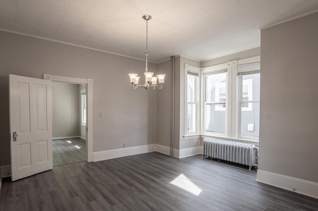 410 Baker St W, Saint Paul, MN 55107 - spare room featuring radiator heating unit, ornamental molding, dark wood finished floors, and a chandelier