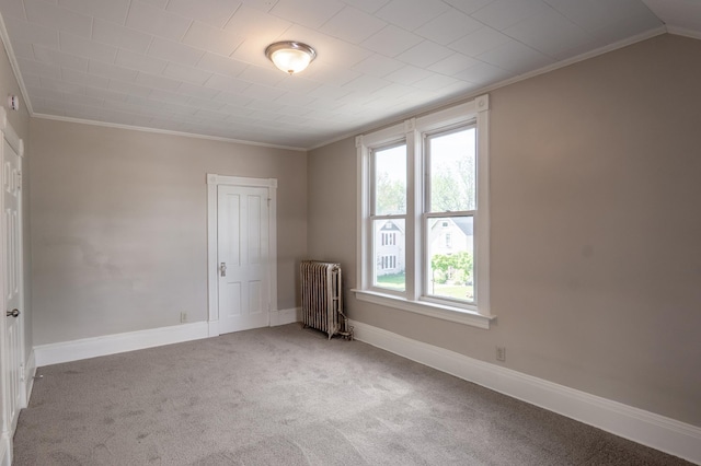 410 Baker St W, Saint Paul, MN 55107 - spare room featuring radiator heating unit, ornamental molding, plenty of natural light, carpet floors, and baseboards