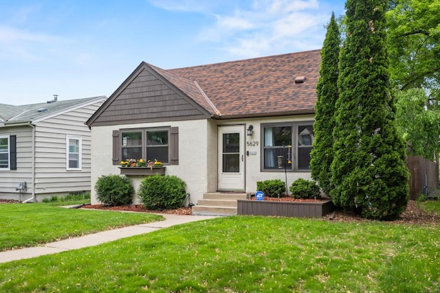 5629 35th Ave S, Minneapolis, MN 55417 - view of front facade featuring a shingled roof