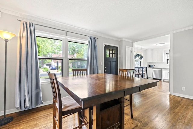 5629 35th Ave S, Minneapolis, MN 55417 - dining space featuring crown molding, wood finished floors, and baseboards
