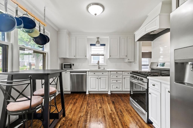 5629 35th Ave S, Minneapolis, MN 55417 - kitchen featuring stainless steel appliances, a sink, dark wood-style floors, light countertops, and white cabinetry