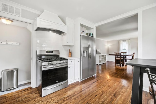 5629 35th Ave S, Minneapolis, MN 55417 - kitchen with stainless steel appliances, custom exhaust hood, white cabinetry, and crown molding