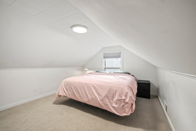 5629 35th Ave S, Minneapolis, MN 55417 - carpeted bedroom featuring vaulted ceiling and baseboards