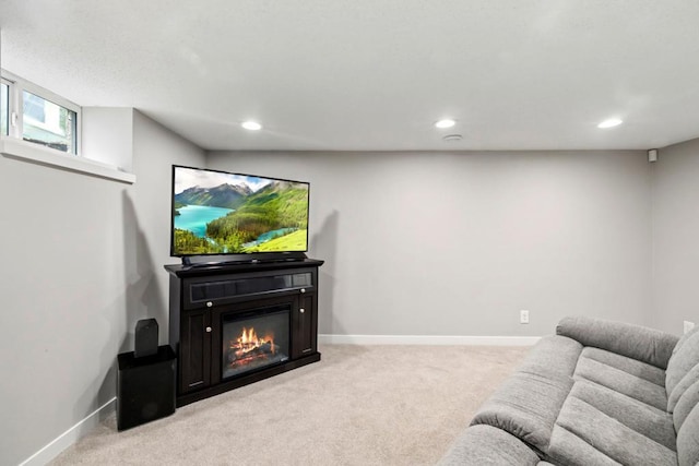 5629 35th Ave S, Minneapolis, MN 55417 - living area with light carpet, recessed lighting, a glass covered fireplace, and baseboards