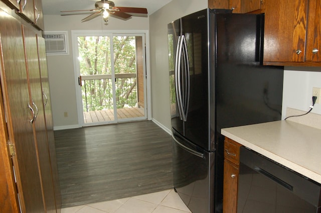 7600 157th St W Unit 307, Apple Valley, MN 55124 - kitchen featuring black appliances, ceiling fan, light countertops, a wall unit AC, and baseboards