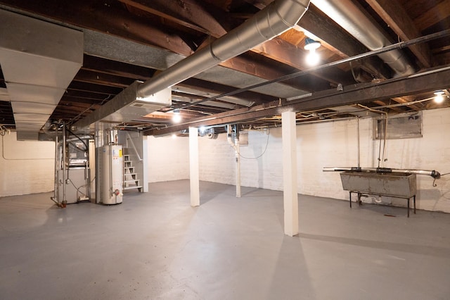 unfinished below grade area featuring water heater and stairs