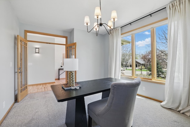2464 Cottage Grove Dr, Woodbury, MN 55129 - carpeted home office with a chandelier and baseboards