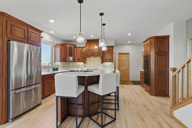 2464 Cottage Grove Dr, Woodbury, MN 55129 - kitchen featuring freestanding refrigerator, custom exhaust hood, light wood-style flooring, light countertops, and tasteful backsplash