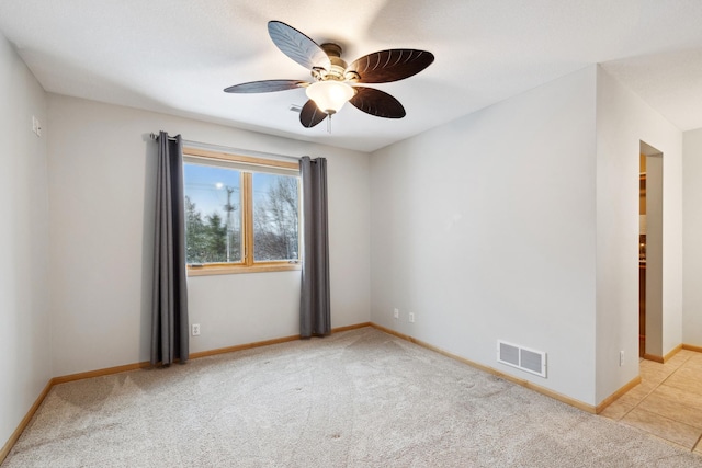 2464 Cottage Grove Dr, Woodbury, MN 55129 - carpeted spare room with ceiling fan and baseboards
