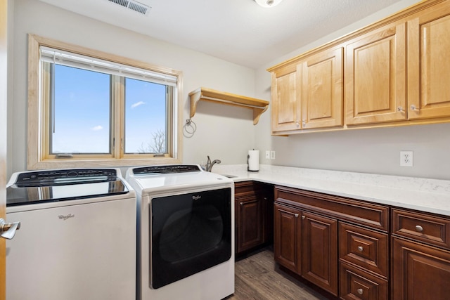 2464 Cottage Grove Dr, Woodbury, MN 55129 - laundry area featuring cabinet space, independent washer and dryer, and dark wood-style flooring