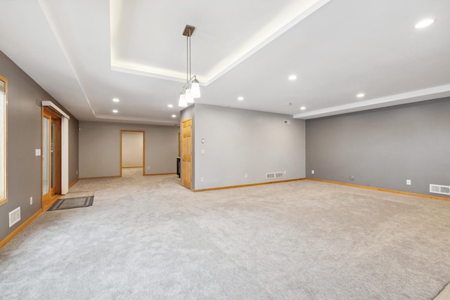 2464 Cottage Grove Dr, Woodbury, MN 55129 - empty room featuring recessed lighting, baseboards, light carpet, and a tray ceiling