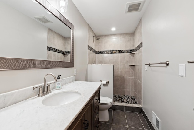 2464 Cottage Grove Dr, Woodbury, MN 55129 - full bathroom with tile patterned floors, toilet, a walk in shower, and vanity