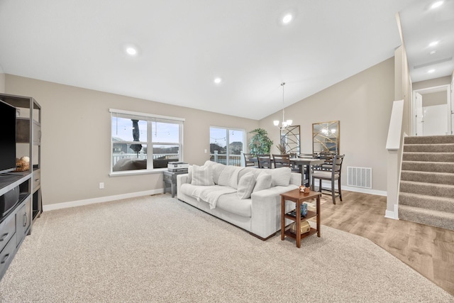 12262 71st St NE, Otsego, MN 55330 - living area featuring stairway, vaulted ceiling, baseboards, a chandelier, and recessed lighting