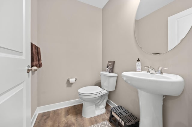 12262 71st St NE, Otsego, MN 55330 - bathroom with wood finished floors, toilet, and baseboards
