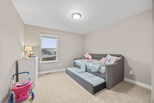 12262 71st St NE, Otsego, MN 55330 - carpeted bedroom with baseboards and a textured ceiling