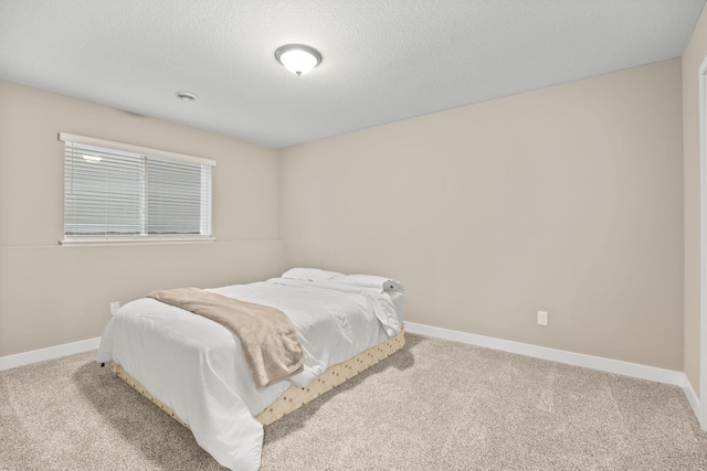 12262 71st St NE, Otsego, MN 55330 - carpeted bedroom with baseboards and a textured ceiling
