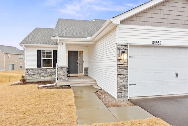 12262 71st St NE, Otsego, MN 55330 - view of front facade featuring stone siding, roof with shingles, an attached garage, and a front yard