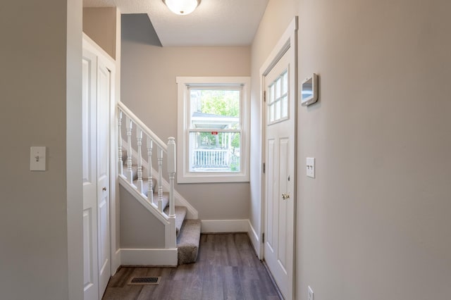 1602 Johnson St NE, Minneapolis, MN 55413 - entrance foyer with wood finished floors, stairway, and baseboards