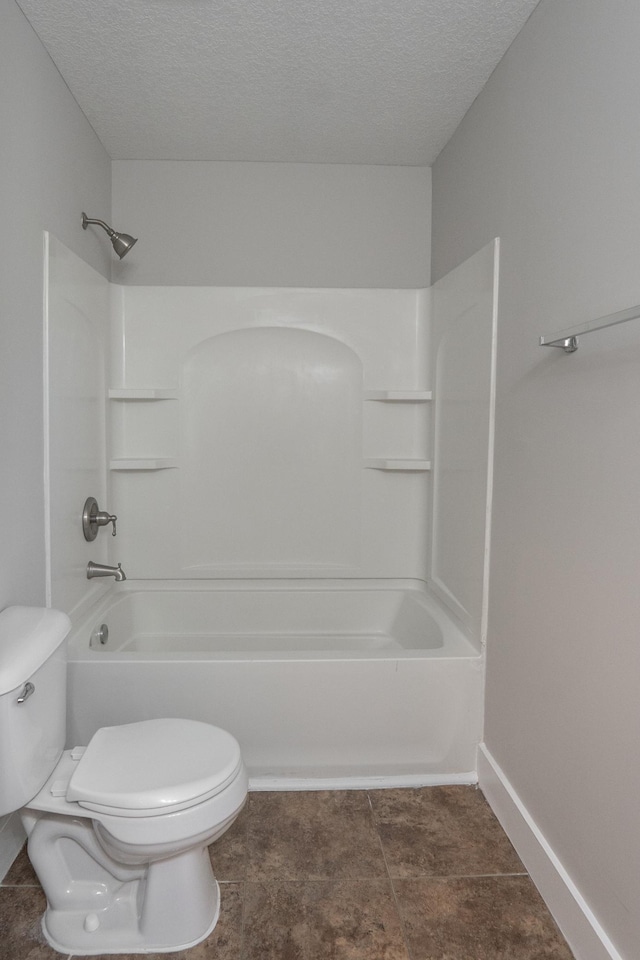 1602 Johnson St NE, Minneapolis, MN 55413 - full bath with toilet, shower / tub combination, a textured ceiling, and baseboards