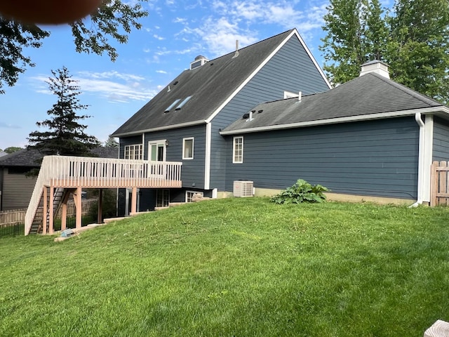 1905 11th St SW, Rochester, MN 55902 - rear view of house featuring a wooden deck, a chimney, stairway, and a shingled roof