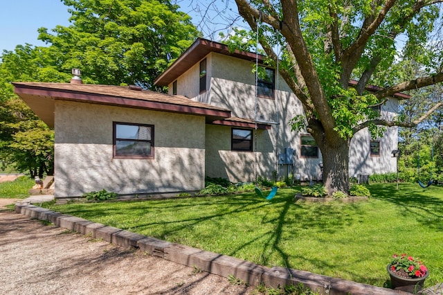 6420 Rolling Hills Rd, Corcoran, MN 55340 - view of side of home featuring a yard and stucco siding