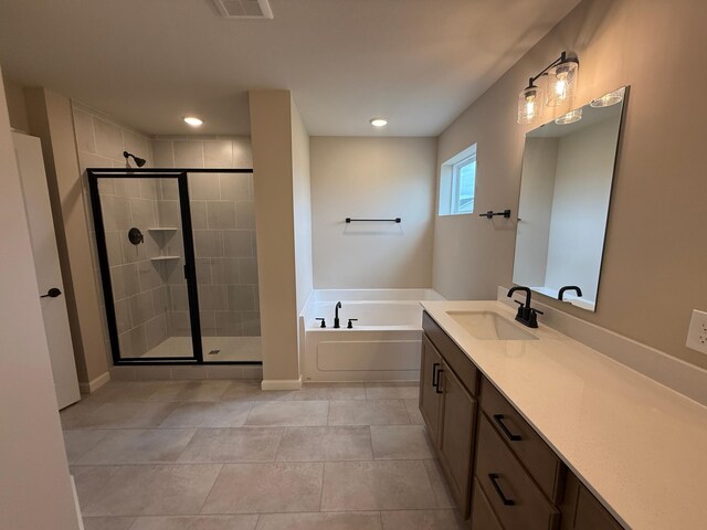 bathroom featuring a stall shower, a garden tub, vanity, tile patterned floors, and recessed lighting