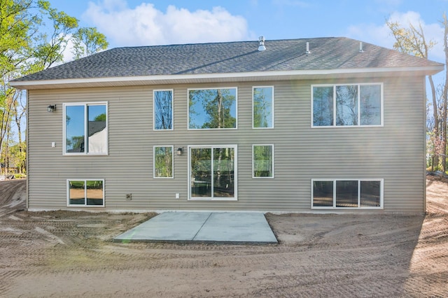 14633 Packard St NE, Ham Lake, MN 55304 - back of property with a patio area and a shingled roof
