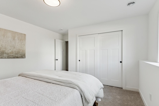 14633 Packard St NE, Ham Lake, MN 55304 - bedroom featuring light carpet and a closet