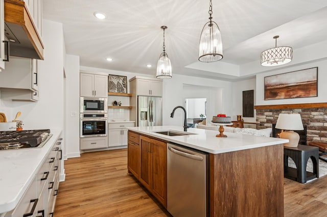 14633 Packard St NE, Ham Lake, MN 55304 - kitchen featuring appliances with stainless steel finishes, premium range hood, open shelves, light countertops, and recessed lighting