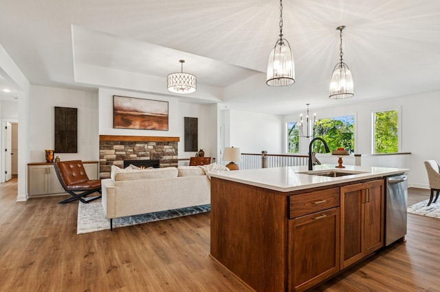 14633 Packard St NE, Ham Lake, MN 55304 - kitchen with dishwasher, a chandelier, light countertops, dark wood-type flooring, and pendant lighting